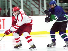 Ben Smaha of the Kenora Midget AAA Thistles is tracked by a Parkland Rangers defender in Manitoba Midget AAA Hockey League action during a 9-0 win by the Thistles on Nov. 3.