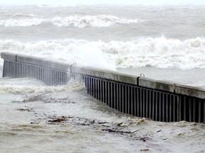 Waves crashed along the coastline in Bright's Grove during the recent super storm. (Postmedia Network file photo)