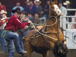 Curtis Cassidy competes in the calf roping event during the final day of Canadian Finals Rodeo (CFR) at Rexall Place in Edmonton on Sunday, November 11, 2012. CODIE MCLACHLAN/EDMONTON SUN QMI AGENCY