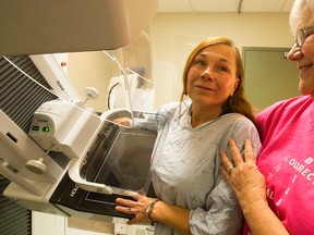 Senior technologist Deb McCullough assists patient Sandy Martin in the mammography room for breast screening during the Integrated Screening Day for breast, cervical and colorectal cancer on Saturday, Nov. 10, 2012 at Peterborough Regional Health Centre. (QMI Agency file photo)