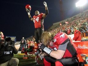Stampeders quarterback, Drew Tate celebrates a touchdown pass against the Roughriders during the West semifinal game at McMahon stadium in Calgary, Alta., Nov. 11, 2012. (DARREN MAKOWICHUK/QMI Agency)
