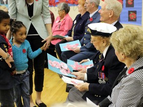 Young students visit with veterans at Dalton school last week. DALE BOYD/ SPECIAL TO THE EXAMINER