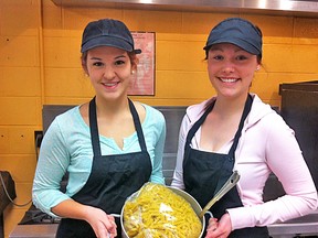 Rachel Paret and Sidney Robertson, Glendale HS Key Club, are ready for Thursday's Spaghetti Dinner fundraiser.