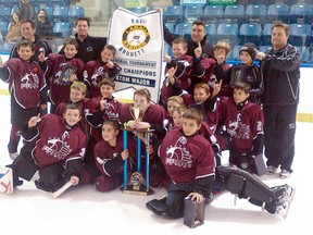 The Kent TekSavvy Major Atom 'AA' Cobras celebrate their victory Sunday at the Randy Brunett Memorial Tournament in LaSalle. (Contributed Photo)
