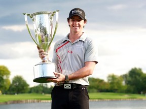 Rory McIlroy of Northern Ireland poses with the champion's trophy after winning the PGA Championship golf tournament in Carmel, Indiana September 9, 2012.  (REUTERS)