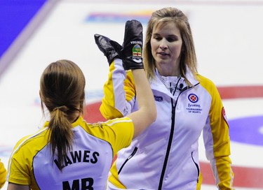 Manitoba skip Jennifer Jones (R) celebrates with third Kaitlyn Lawes after they defeated Quebec to win the bronze medal game at the Scotties Tournament of Hearts curling championship in Red Deer, Alberta February 26, 2012. REUTERS/Todd Korol  (CANADA - Tags: SPORT CURLING)