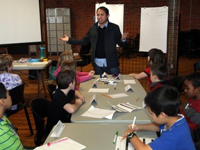 Ken Bautista, CEO Startup Edmonton welcomes a  grade 4 class from Kameyosek Elementary during their entrepreneur field trip at the Mercer Building in Edmonton, Alberta  on November 13,  2012.  Startup Edmonton is kicking off Entrepreneur Week in their offices this morning.  PERRY MAH/EDMONTON SUN  QMI AGENCY