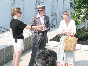 TryLight Theatre’s Living History Project performers act out a scene from Kenora’s colourful past on Main Street during July.