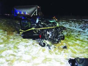 A black pickup truck is barely recognizable following a three-vehicle collision early Wednesday morning on Highway 63, north of Boyle. The collision, which also involved two tractor trailers, has left one man in critical condition after he was airlifted to an Edmonton-area hospital. SUPPLIED PHOTO
