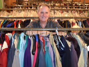 Jack Flagler, owner of Douglas Cleaners in Owen Sound, with some of the approximately 600 used winter coats he has collected this year. Flagler will open his shop Saturday during the Santa Claus parade to give the coats away to those in need. James Masters The Sun Times.