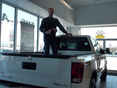 Rich Pope picked up a new Nissan truck on Wednesday, Nov. 14, 2012. Pope, the multimedia editor at the Winnipeg Sun, kicked his way to a tidy payday at TSN Wendy's Kick For A Million event at Rogers Centre in Toronto on Oct. 19, taking home a $25,000 gift card from The Source, a Nissan Titan PRO-4X pickup truck and $42,000 cash. (Doug Lunney, Winnipeg Sun)