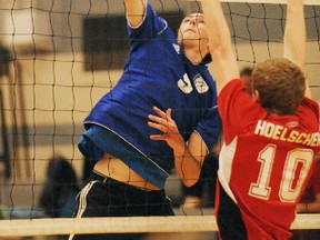 Kevin Allemang of the Simcoe Sabres senior boys volleyball team smashes the ball in the CWOSSA final against the Norwell Redmen on Wednesday at Simcoe Composite School. Norwell won the match in three straight sets. Simcoe came away with silver medals. (DANIEL R. PEARCE Simcoe Reformer)