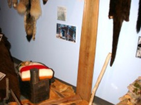 Museum Archive Photo IMG-3906
Trapping accoutrements – traps, stretchers, survival gear and the pelts of sought animals. Trappers were and are provisioners of the needs of their families and those of others.