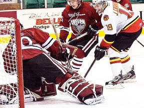 Belleville Bulls overage forward Joseph Cramarossa drives the Guelph Storm net during OHL action Wednesday night at Yardmen Arena. (Don Carr for The Intelligencer.)