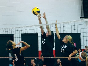 Calista Sainsbury of the La Verendrye School Dark team goes up for a block against Yellowqulll Black's Haley Swidnicki during a 2-0 Voyageur win in the league championship game at LVS on Wednesday. (Dan Falloon/Portage Daily Graphic)