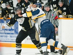 Golden Hawks defenceman Loren Ulett and Whitby's Tyler Park threw punches during the third period of last Friday's 3-2 home loss.  For more coverage see Page 30. 
Justin Tang for the Trentonian