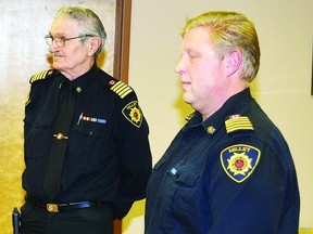 Blair Mohr, right, addresses town council at its Nov. 14, 2012, meeting after being confirmed as the new Millet fire chief. Al Kilborn, who was interim fire chief for little more than a year, officially resigned after spending 40 years as a volunteer firefighter in the community, north of Wetaskiwin.