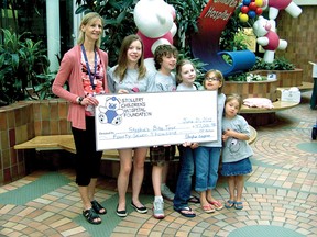 Joanna Pattison, of the Stollery Children's Hospital Foundation, accepts a $47,000 cheque from Alexandra Gagnon, Nicholas Gagnon, Stephie Gagnon, Kate Hunt and Kenndy Hunt. The proceeds were raised through Stephie's Bike Tour, held in Fort Saskatchewan at the end of May.