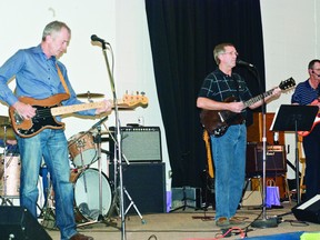 BRIAN VOSSEN PHOTO. Members of Dust Pan Handle on stage during the Parent Link fundraiser held the evening of Nov. 9 at the Pincher Creek Community Hall. Collectively, the members of Dust Pan Handle have had 40 years of history playing events in the Pincher Creek are.