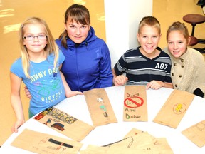 Graeme Bruce/Daily Herald-Tribune
St. Gerard Catholic school students from left: Christina Friesen, Emily Bardak, Ethan Winnicky, and Sydney Winnicky all submitted their own designs for the liquor bag campaign, which reminds motorists not to drink and drive.