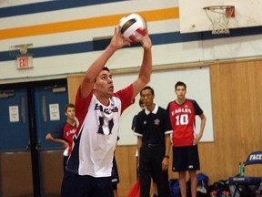 Eagle Jordan Weizenbach sets a ball during his team’s narrow loss in the City Conference final. Photo by Shane Jones/Sherwood Park News/QMI Agency