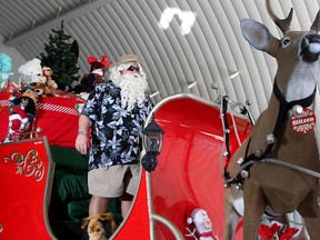 Santa Claus on of his sleigh at CFB Kingston on Thursday as he prepares for the Downtown Kingston Night Time Santa Claus Parade on Saturday.
Ian MacAlpine The Whig-Standard