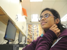 Graeme Bruce/Daily Herald-Tribune
Anusha Khepar, Grade 9 student at Crystal Park school, works on a news story for the school’s journalism blog.