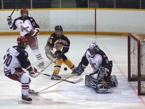 Legion goalie Nick Lelievre makes this great poke check during the second period of Kirkland Lake's 8-1 loss to New Liskeard Thursday night.