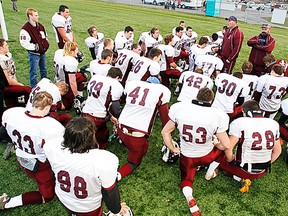 Defensive coach, Dwayne Lambert, addresses the Moira Trojans prior to kick-off Thursday at Sills Park Field 2 while head coach, Dave Corbett, looks on. (Jerome Lessard/The Intelligencer.)