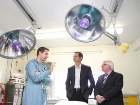 Dr. Rob Anderson, left, medical director of the simulation centre at Health Sciences North Sudbury Outpatient Centre, gives a tour of a lab for Ontario Premier Dalton McGuinty (middle) and Sudbury MPP Rick Bartolucci in Sudbury, ON. on Thursday, November 15, 2012. JOHN LAPPA/THE SUDBURY STAR/QMI AGENCY