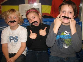 Students at St. Joseph’s School in Simcoe contributed in their own way to Movember Showing off their moustaches, from left to right are Grade 3 students Graydon Hosack, Brianne Locki and Noah Hunter.  (SARAH DOKTOR Simcoe Reformer)