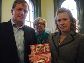 PC MPP Jeff Yurek, left, Central Community Health Centre community programs director Heather Moller and dental hygienist Sarah Foshay with one of the Ontario Oral Health Alliance postcards.