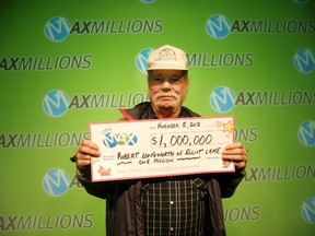 Elliot Lake resident Robert Longworth shows his million-dollar cheque.
Photo supplied