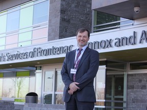 Steve Woodman, executive director of the Family and Children's Services of Frontenac, Lennox and Addington, stands in front of the completed, $23-million building on Division Street. The building celebrated its official opening Friday. 
Danielle VandenBrink/The Whig-Standard