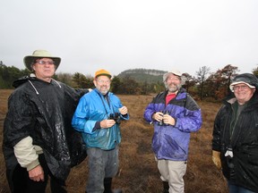 John Grant of the Nature Conservancy of Canada, left, and Owen Sound Field Naturalists members Art Wiebe, Doug Pedwell and Stewart Nutt on part of the Chester Greiling estate. The field naturalists made a donation towards the purchase of the property in memory of former president Lorraine Brown.