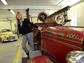 Wendy Paul, director of the Northern Ontario Railroad Museum and Heritage Centre, shows off a 1929 Bickle fire truck that was onced used by the fire department in Capreol. JOHN LAPPA/THE SUDBURY STAR/QMI AGENCY
