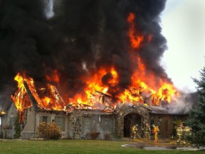 Prince Edward County firefighters are on the scene of a massive house fire at 314 Rednersville Road, south of Belleville, Ont. Saturday, Nov. 17, 2012. They received a call just before 11 a.m. this morning (Saturday). Bruce Bell/QMI Agency.