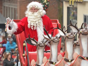 Santa waves to the crowd Saturday during the annual Kiwanis Santa Claus parade in Owen Sound.