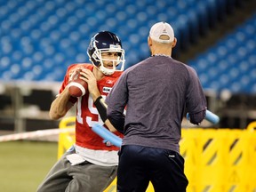 Toronto Argonauts QB  Ricky Ray  is hit with a pool noodles to simulate pass pressure during practice at the Rogers Centre on Friday.
Veronica Henri/QMI Agency