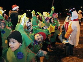Young school children dressed as trees smiles for the camera. RACHELE LABRECQUE - SAULT STAR/ QMI AGENCY