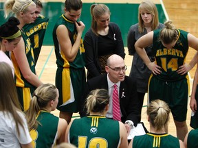 Alberta Pandas coach Scott Edwards talks to his players during their Canada West basketball game against the Lethrbridge Pronghorns at Edmonton's Saville Community Sports Centre on Nov. 17, 2012.