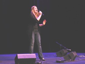 Peace Country Idol first-place winner Caitlin Card performs Saturday at the Douglas J. Cardinal Performing Arts Centre. Card beat out 15 other contestants that performs during the final round of the competition. (Adam Jackson/Daily Herald-Tribune)