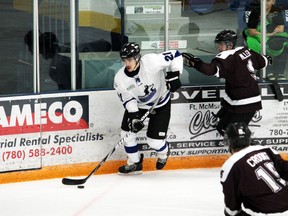 Huskies forward Mac McMurphy heads for the net during the third period against Grant MacEwan Griffins Saturday at the Casman Centre. McMurphy scored the game-winning goal shortly after securing the win for the Huskies at 5-2. SHIRLEY LIN/TODAY STAFF