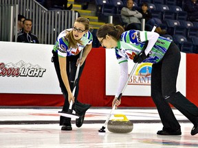 KARA WILSON, for The Expositor                                                                                                                                              

Alison Kreviazuk (left) and Lisa Weagle from Ontario's Rachel Homan rink guide a rock down the ice during the women's championship Sunday at The Masters Grand Slam of Curling at the Wayne Gretzky Sports Centre. Homan defeated Manitoba's Chelsea Cary to claim the title.