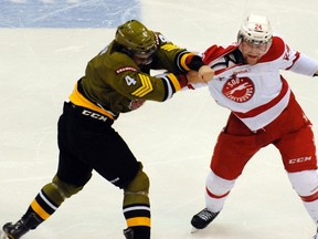 Marcus McIvor of the Brampton Battalion trades blows with Alex Gudbranson of the Sault Greyhounds during Friday's 4-3 Battalion win (Sean Ryan photo)