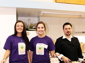 Rachelle Lavoie, Jessica Beliveau and Alister Green prepare Saturday night’s pasta dinner held at the South Porcupine Scout Hall by the BASIC group of Timmins. BASIC raised funds to further their efforts with the Yo! Mobile and their campaign to see a new homeless shelter built in Timmins.