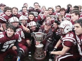 Members of the St. Mary's Knights celebrate after winning the NOSSA championship.