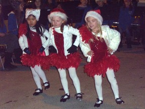 Five-year-old Haylie Chan, six-year-old Kaylie Walsh and five-year-old Ella Stepaniak, members of Sandra's Tap and Jazz, kicked-off Shopper's Night in Port Elgin with a routine Thursday night. The trio tapped along to "Do Re Me" in front of the Town’s Christmas Tree as hundreds of people looked on.