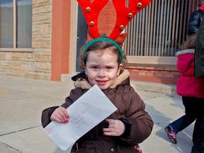 Three-and-a-half-year old Leena Gasson holds her letter written to Santa. (SABRINA BURRELL, QMI Agency)