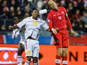 Canada's Kevin McKenna (right) battles for the ball against Cuba during a World Cup qualifying match in Toronto on Oct. 12, 2012. (Ernest Doroszuk/QMI Agency)